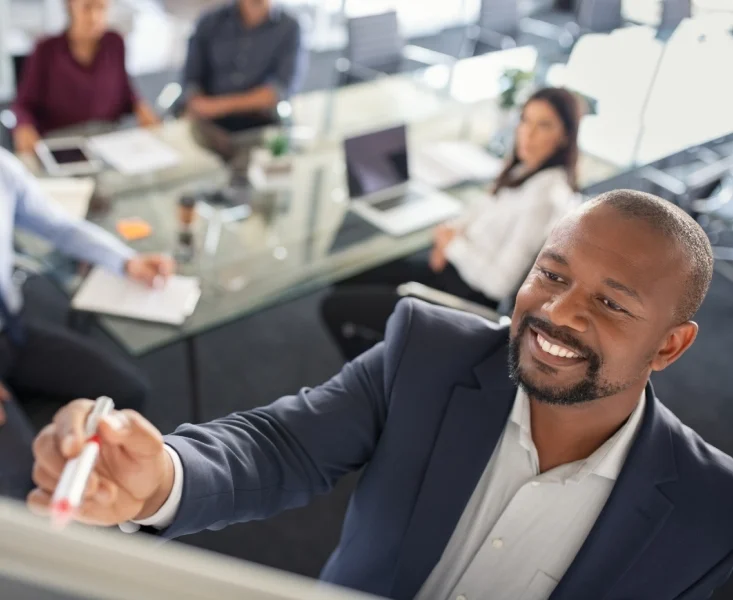 man-writting-on-board-e1771762763740-1